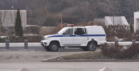 Полицейский автомобиль на улице Алматы