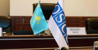 Флаги республики Казахстан и ОБСЕ в ЦИК РК