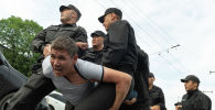 Задержание участника митинга в Алматы
