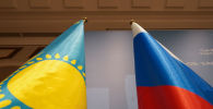 Флаги Казахстана и России на заседании Межправкомиссии по сотрудничеству между Казахстаном и Россией