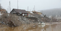  Вид после обрушения плотины недалеко от города Щетинкино, примерно в 250 км от Красноярска