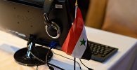 Флаг Сирии в информцентре для журналистов, архивное фото 