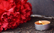 Цветы и свечи в память о жертвах теракта в метро Санкт-Петербурга возле Генконсульства Алматы Цветы и свечи в память о жертвах теракта в метро Санкт-Петербурга возле Генконсульства Алматы