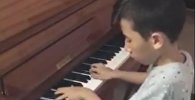 Самый юный композитор Казахстана Нурали Бейсекожа сочинил вальс в память о Денисе Тене