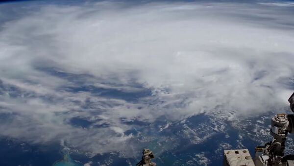 Как выглядит катастрофический ураган Лаура из космоса - незабываемое видео  - Sputnik Казахстан