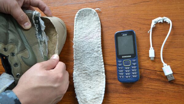 Телефон обнаружили в подошве обуви - Sputnik Казахстан