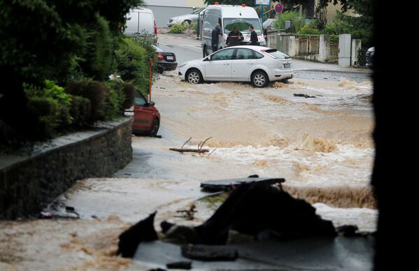 Затопленная улица после проливных дождей в Хагене, Германия  - Sputnik Казахстан