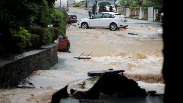 Затопленная улица после проливных дождей в Хагене, Германия  - Sputnik Казахстан