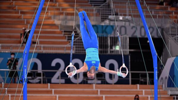 Милад Карими выступает на кольцах в олимпийском многоборье - Sputnik Казахстан
