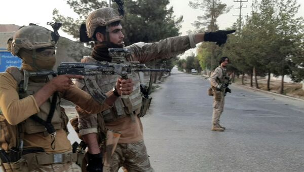 Военные афганских спецподразделений во время боя с боевиками Талибана* в Лашкар-Гахе, провинция Гильменд, на юге Афганистана - Sputnik Казахстан