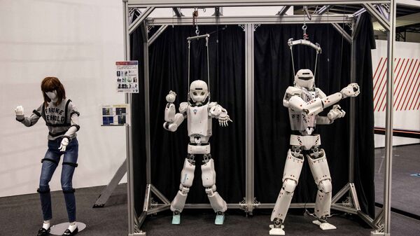 Роботы Kawasaki humanoid на Международной выставке роботов в Токио - Sputnik Казахстан
