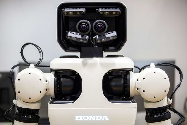 Робот-аватар Honda на Международной выставке роботов в Токио. - Sputnik Казахстан