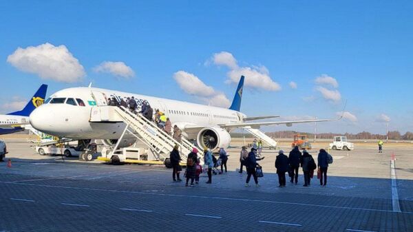 Шестой репатриационный рейс Air Astana из Катовице  - Sputnik Казахстан