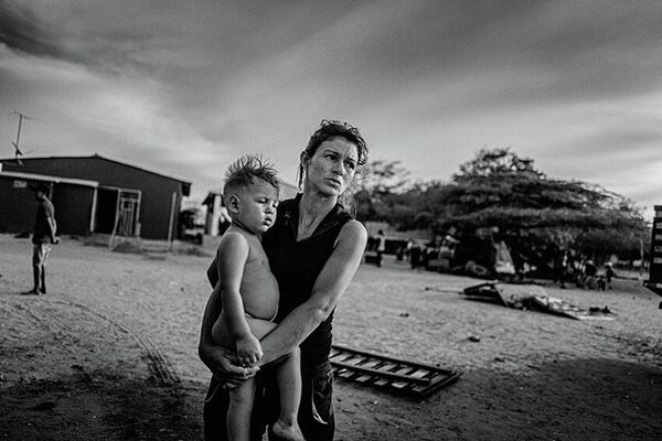 Снимок из серии &quot;Венесуэльский мигрант&quot;, датского фотографа Яна Грарупа, победившего в категории &quot;Профессиональное документальное кино&quot;. - Sputnik Казахстан