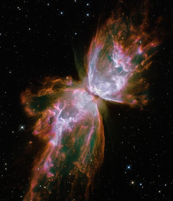 Планетарная туманность NGC 6302, также известная как туманность &quot;Жук&quot; и туманность &quot;Бабочка&quot; поражают своими красками и размерами. Это биполярная планетарная туманность в созвездии Скорпион. Имеет одну из самых сложных структур среди известных полярных туманностей. Центральная звезда туманности была обнаружена телескопом Хаббл в 2009 году, температура её поверхности превышает 200 000 градусов Цельсия. - Sputnik Казахстан