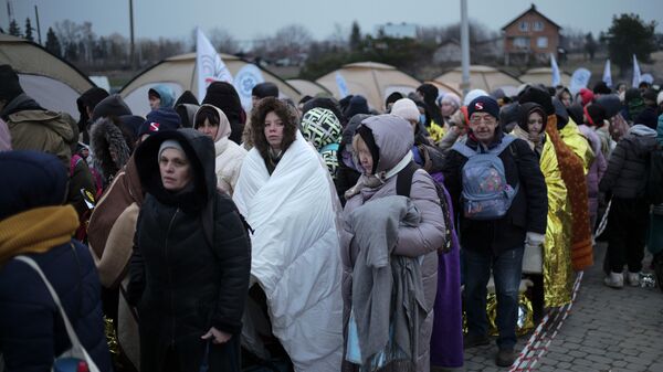 Беженцы на украинско-польской границе - Sputnik Казахстан