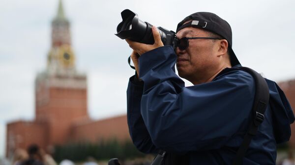 Фотограф на Красной площади в Москве - Sputnik Казахстан