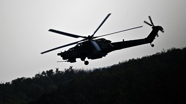 Вертолет Ми-28  во время боевого вылета в зоне СВО - Sputnik Казахстан