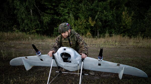 Боевая работа расчета БПЛА КВО спецназа Ахмат группировки войск Север на Сумском направлении СВО - Sputnik Казахстан