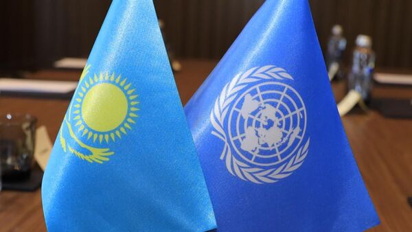 Флаги Казахстана и ООН - Sputnik Казахстан