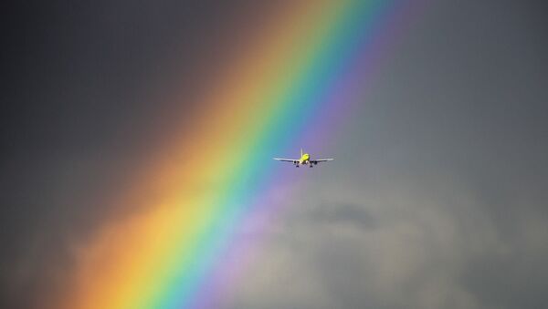 Самолет на фоне радуги, иллюстративное фото - Sputnik Казахстан