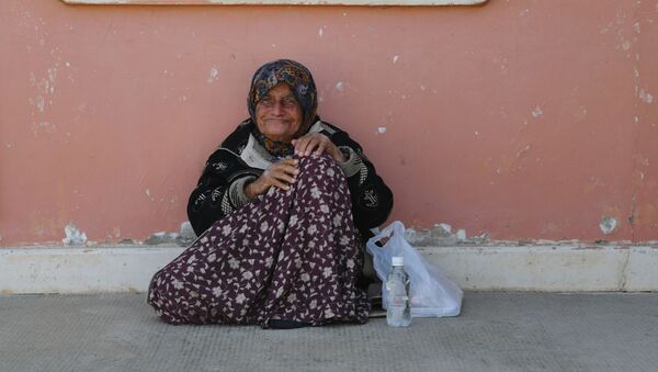 Женщина в лагере беженцев Хирджилла вблизи Дамаска - Sputnik Казахстан