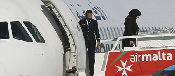 Освобождение заложников захваченного ливийского самолета - Sputnik Казахстан