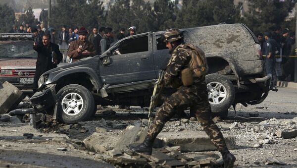 Афганские сотрудники службы безопасности на месте взрыва в Кабуле, Афганистан - Sputnik Казахстан
