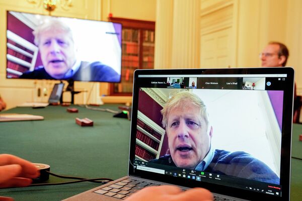 A handout picture released by 10 Downing Street, the office of the British prime minister on March 28, 2020, shows an image of Britain's Prime Minister Boris Johnson on a computer screen as he remotely chairs the morning novel coronavirus Covid-19 meeting by video link, in Downing Street in central London. - The two men leading Britain's fight against the coronavirus -- Prime Minister Boris Johnson and his Health Secretary Matt Hancock -- both announced Friday they had tested positive for COVID-19, as infection rates accelerated and daily death rate rose sharply. (Photo by Andrew PARSONS / 10 Downing Street / AFP) / RESTRICTED TO EDITORIAL USE - MANDATORY CREDIT AFP PHOTO / 10 DOWNING STREET / ANDREW PARSONS / HANDOUT - NO MARKETING - NO ADVERTISING CAMPAIGNS - DISTRIBUTED AS A SERVICE TO CLIENTS - Sputnik Казахстан