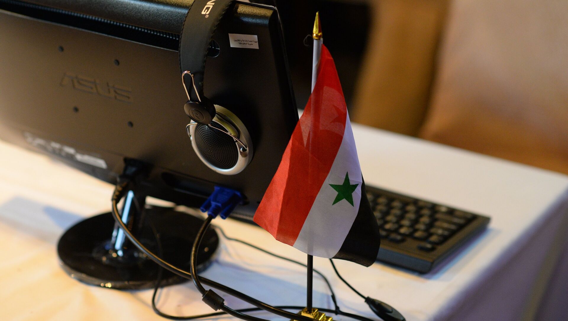 Флаг Сирии в информцентре для журналистов, архивное фото - Sputnik Казахстан, 1920, 16.11.2021