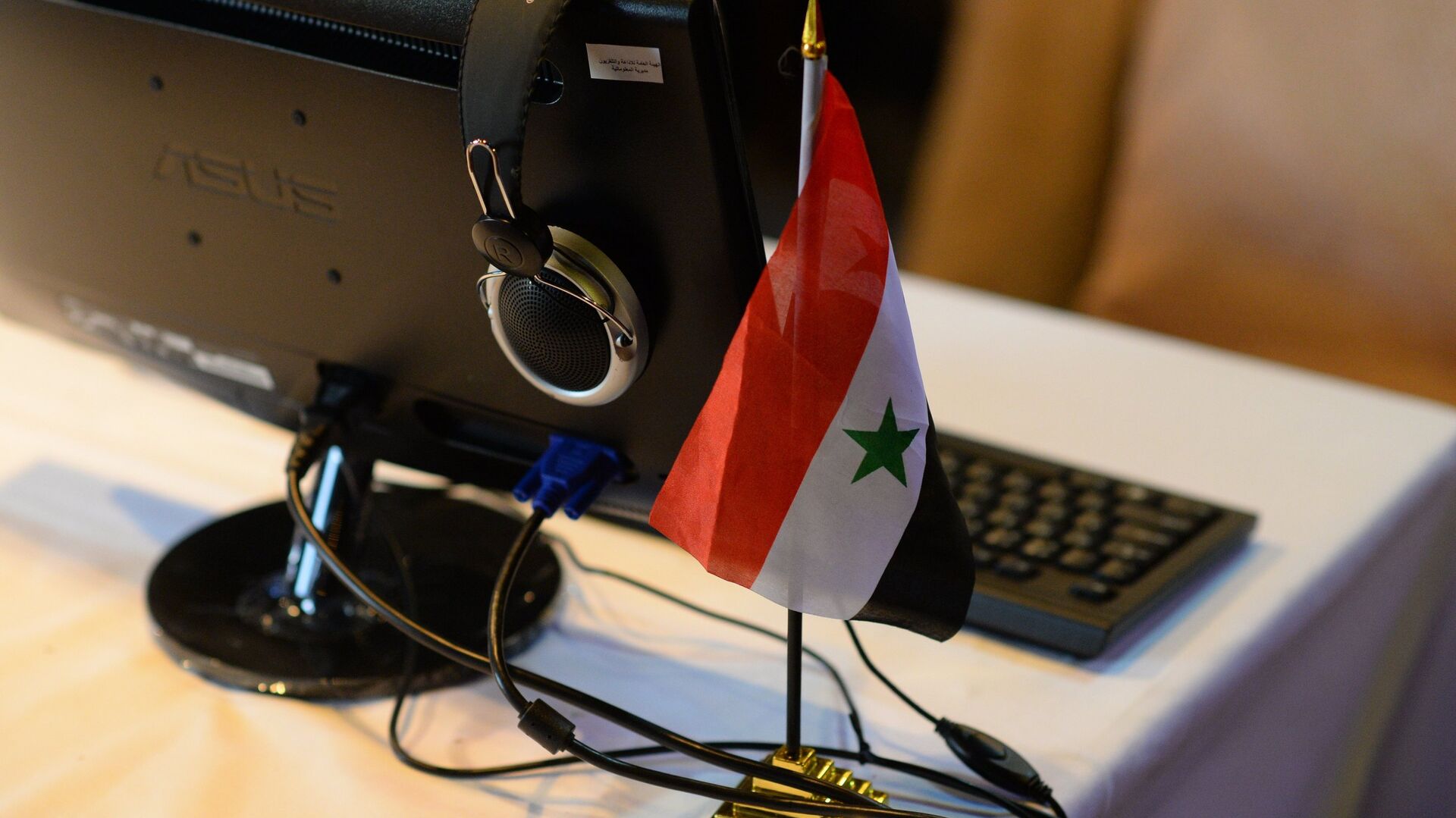 Флаг Сирии в информцентре для журналистов, архивное фото - Sputnik Казахстан, 1920, 22.11.2022