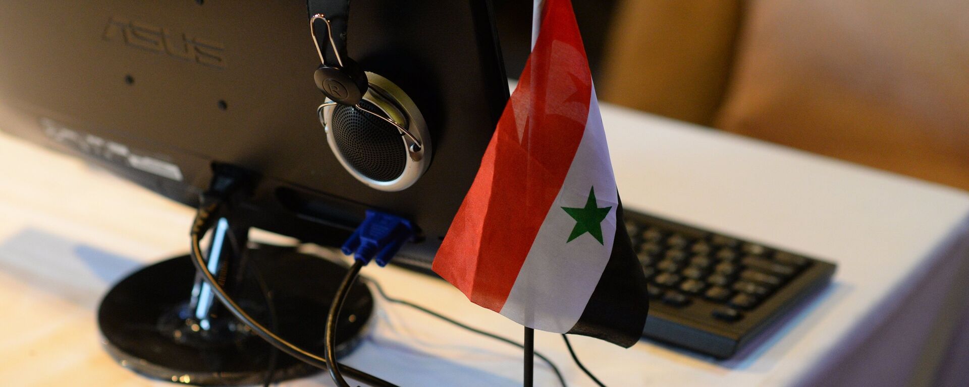 Флаг Сирии в информцентре для журналистов, архивное фото - Sputnik Казахстан, 1920, 24.05.2022
