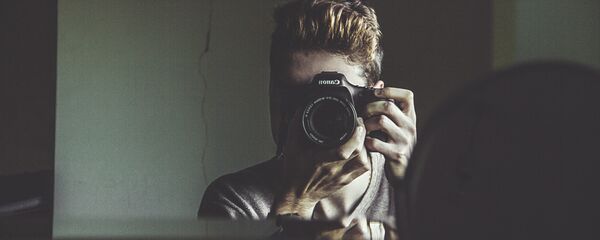 Человек с фотоаппаратом - Sputnik Казахстан