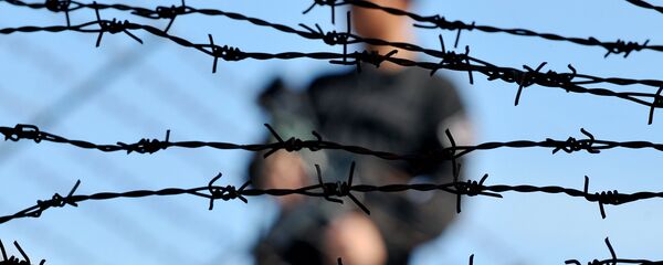 Тюремный охранник, архивное фото Тюремный охранник, архивное фото - Sputnik Казахстан