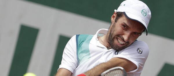 Казахстанский теннесист Михаил Кукушкин во время матча против Тенниса Сандгрена из США на теннисном турнире Открытого чемпионата Франции на стадионе Roland Garros в Париже Казахстанский теннесист Михаил Кукушкин во время матча против Тенниса Сандгрена из США на теннисном турнире Открытого чемпионата Франции на стадионе Roland Garros в Париже - Sputnik Казахстан