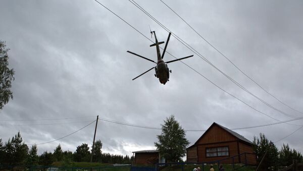 Вертолет над населенным пунктом, архивное фото - Sputnik Казахстан