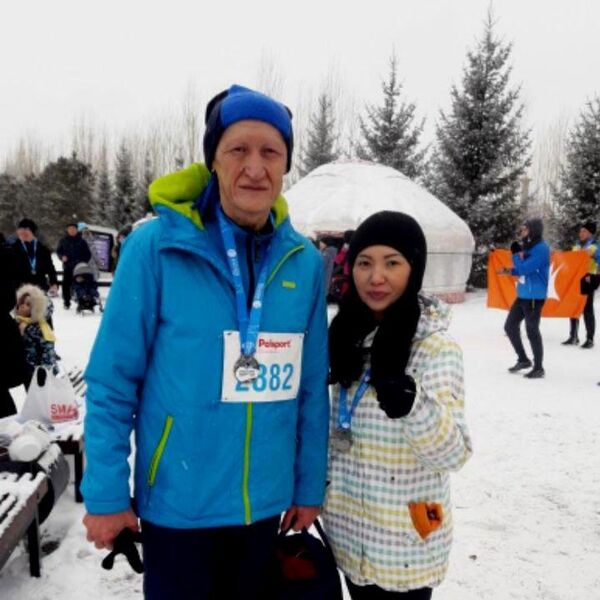 Болат Жамишев и Юлия Кузнецова на финише первого зимнего марафона в Астане - Sputnik Казахстан