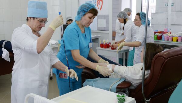 Сдача крови для пострадавших при пожаре в ТЦ Зимняя вишня - Sputnik Казахстан