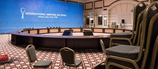 Переговоры в рамках Астанинского процесса по Сирии с участием делегаций стран-гарантов , зал заседаний - Sputnik Казахстан