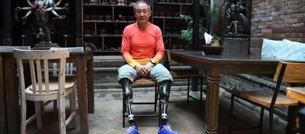 70-летний китайский альпинист Ся Боюй 70-летний китайский альпинист Ся Боюй - Sputnik Казахстан