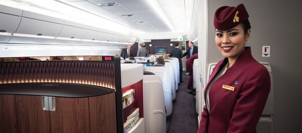 Стюардесса Qatar Airways, архивное фото - Sputnik Казахстан