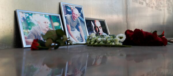 Фотографии журналистов, погибших в Центрально-Азиатской Республике Орхана Джемаля, Кирилла Радченко и Александра Расторгуева (справа налево) - Sputnik Казахстан