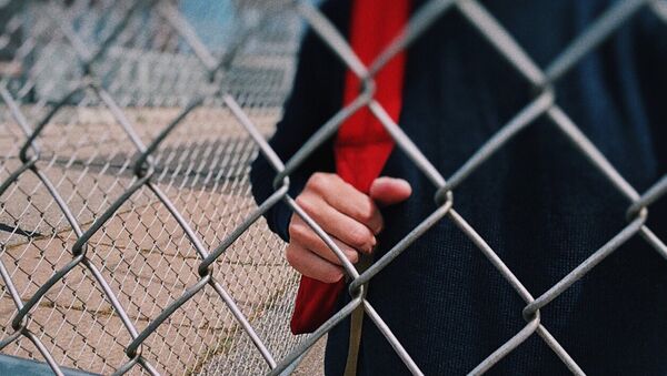 Подросток за забором, архивное фото - Sputnik Казахстан