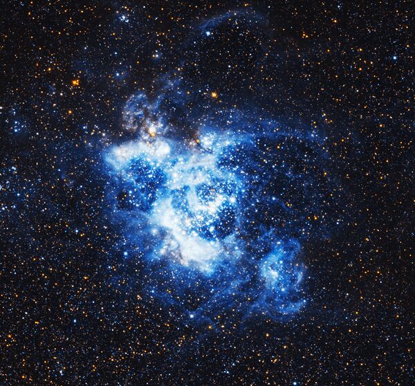 Гигантское газовое облако NGC 604 в галактике Треугольника - Sputnik Казахстан