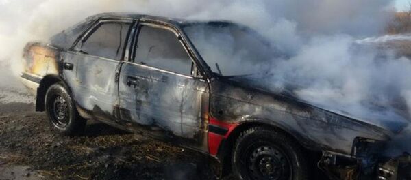 Сгоревший автомобиль. Архивное фото - Sputnik Казахстан