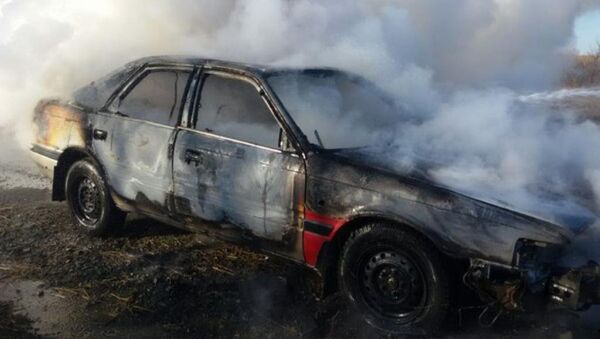 Сгоревший автомобиль. Архивное фото - Sputnik Казахстан