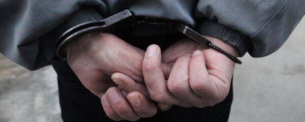 Архивное фото задержанного в наручниках Архивное фото задержанного в наручниках - Sputnik Казахстан